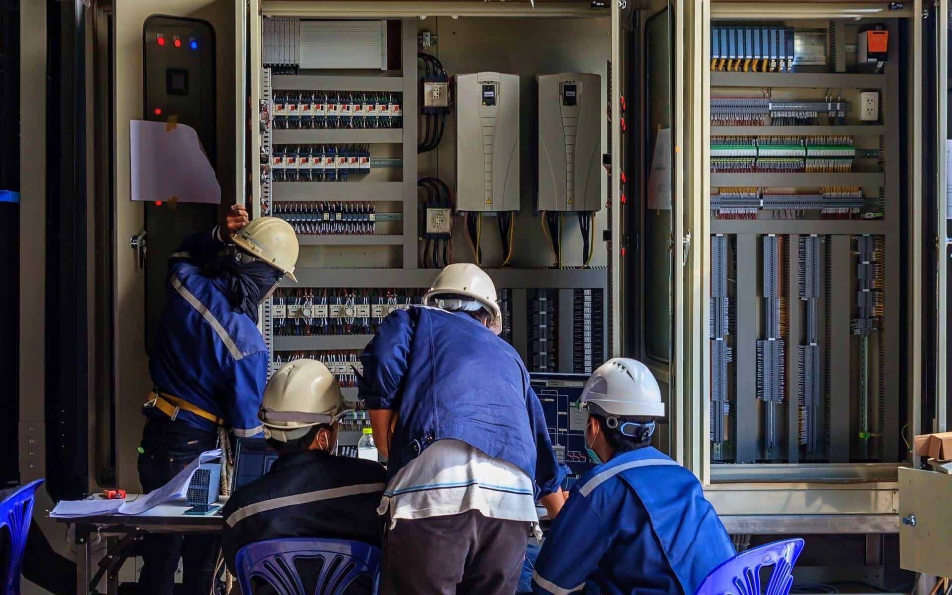 engineer-working-checking-maintenance-equipment-wiring-plc-cabinet_s-min